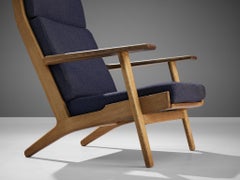 Hans J. Wegner for GETAMA Lounge Chair in Oak and Dark Blue Upholstery