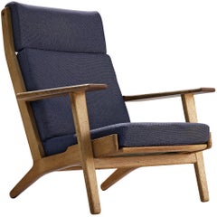 Hans J. Wegner for GETAMA Lounge Chair in Oak and Dark Blue Upholstery