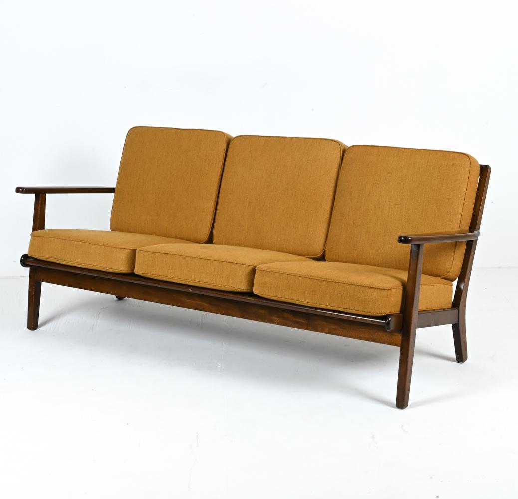 Transcend time with this resplendent Hans J. Wegner for GETAMA Model GE-290 Sofa—a beacon of 1960s Danish design and a testament to understated elegance. Crafted with passion and precision, this piece epitomizes the union of art and function,