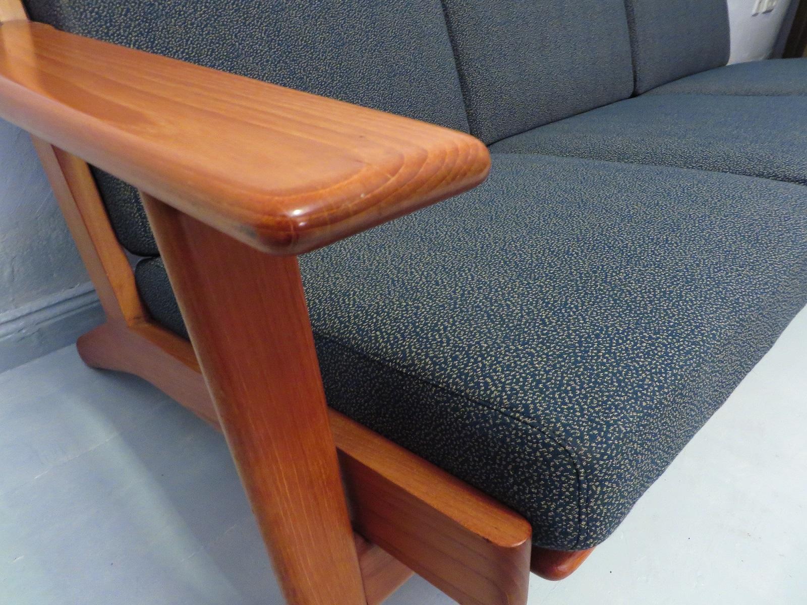 GE 290 3-seat sofa designed by Hans Wegner for Getama, Denmark.
This is an unusual version of the GE 290, in teak instead of the more usual oak. The sprung cushions have been recently re-covered with a beautiful fabric reminiscent of the