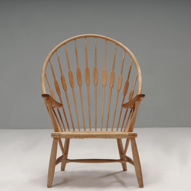 Originally designed by Hans J. Wegner in 1947, the Peacock chair was manufactured by Johannes Hansen until the 1970s.

Inspired by the traditional Windsor chair, Finn Juhl gave the design its Peacock name due to the spindles of the backrest which