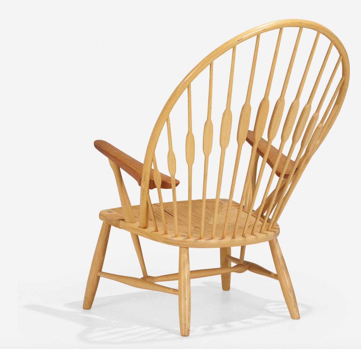 Hans J. Wegner for Johannes Hansen Peacock Chair made in Denmark, 1947
Ash frame with Teak arms and grass cord seatBranded manufacturer's mark to underside ‘Johannes Hansen Copenhagen Denmark’.
Dimensions:
40½ h × 30½ w × 20 d in