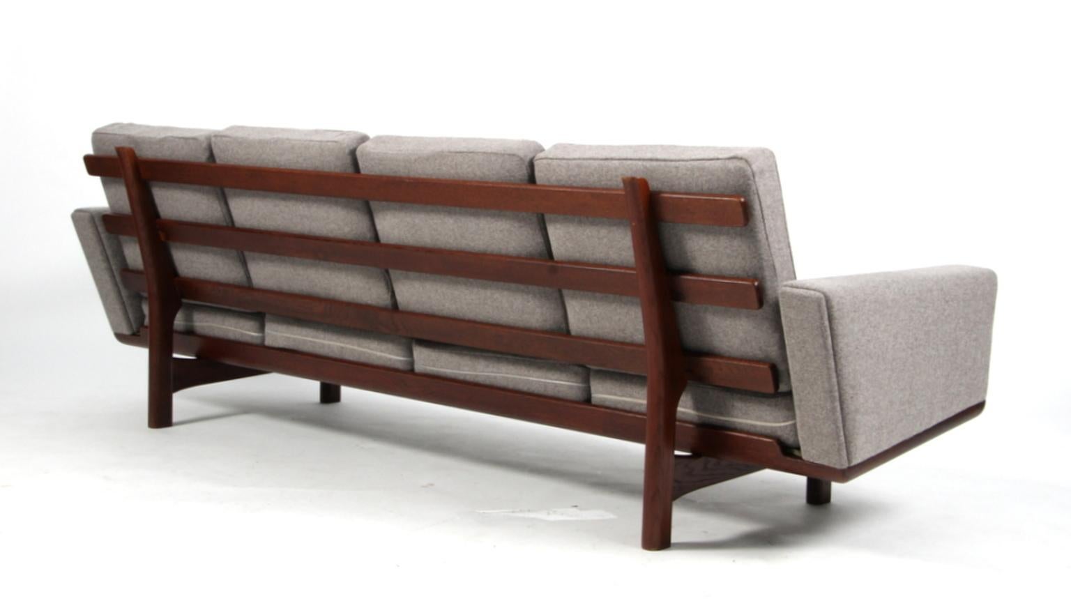 Hans J. Wegner four-seat sofa new upholstered with 100 % New Zealand Divinia wool. Original Epeda cushions.

Frame in massive soap treated oak.

Model 236/4, produced by GETAMA.