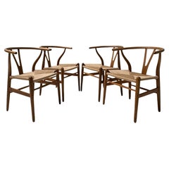 Hans J. Wegner Quattro sedie Wishbone CH 24 per Carl Hansen & Søn, anni '50