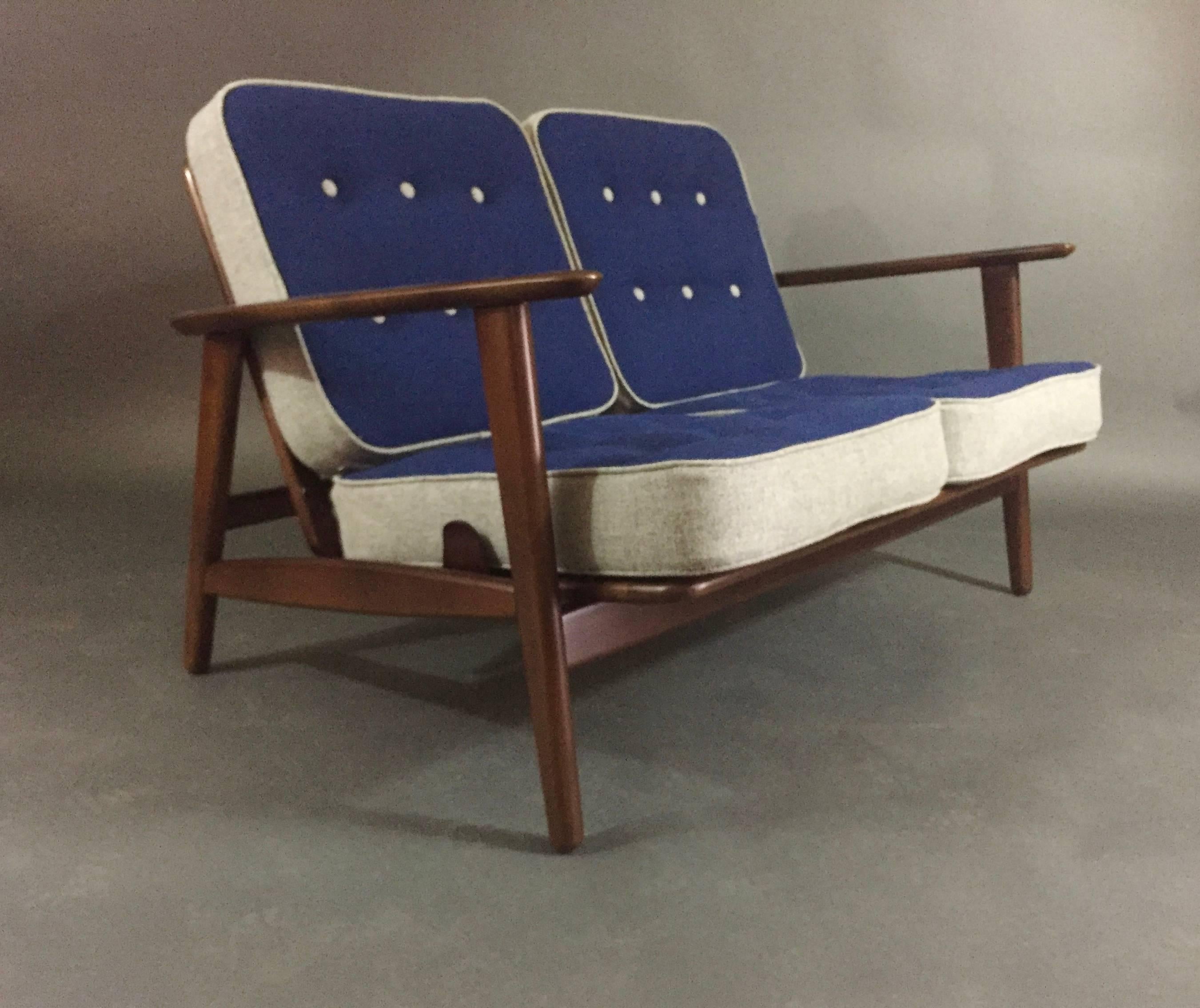 Similar in proportion and design to the Cigar series by Hans J Wegner this example has an interesting side support feature that makes this unique and in our view superior. The two-seat sofa or settee has four cushions - all with original springs for