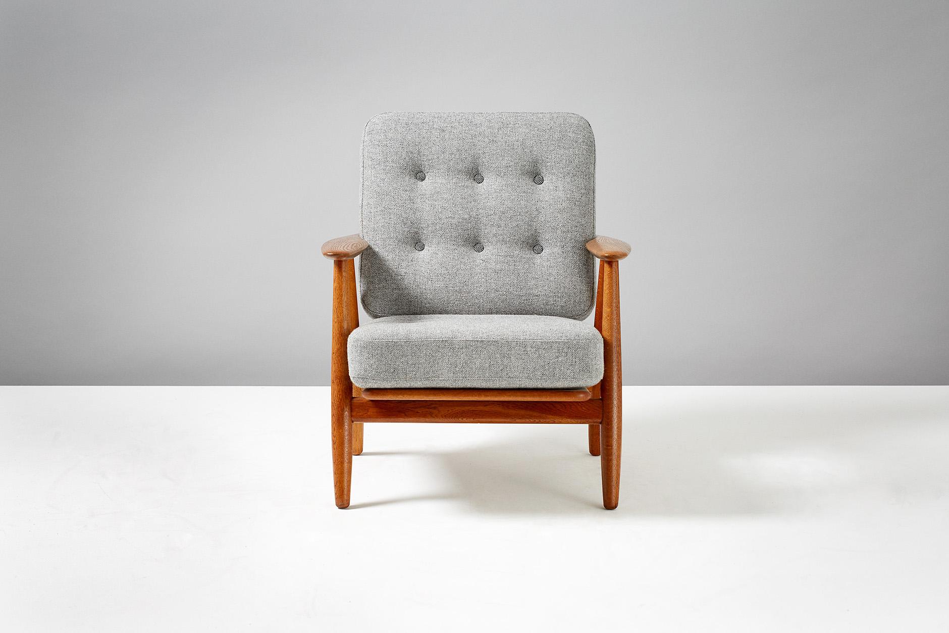 Hans J. Wegner

GE-240 'Cigar' chair, 1955

Produced by GETAMA, Gedsted, Denmark. Oak frame with original sprung cushions reupholstered in two-tone grey Kvadrat Hallingdal wool fabric. Maker's brand under seat.

