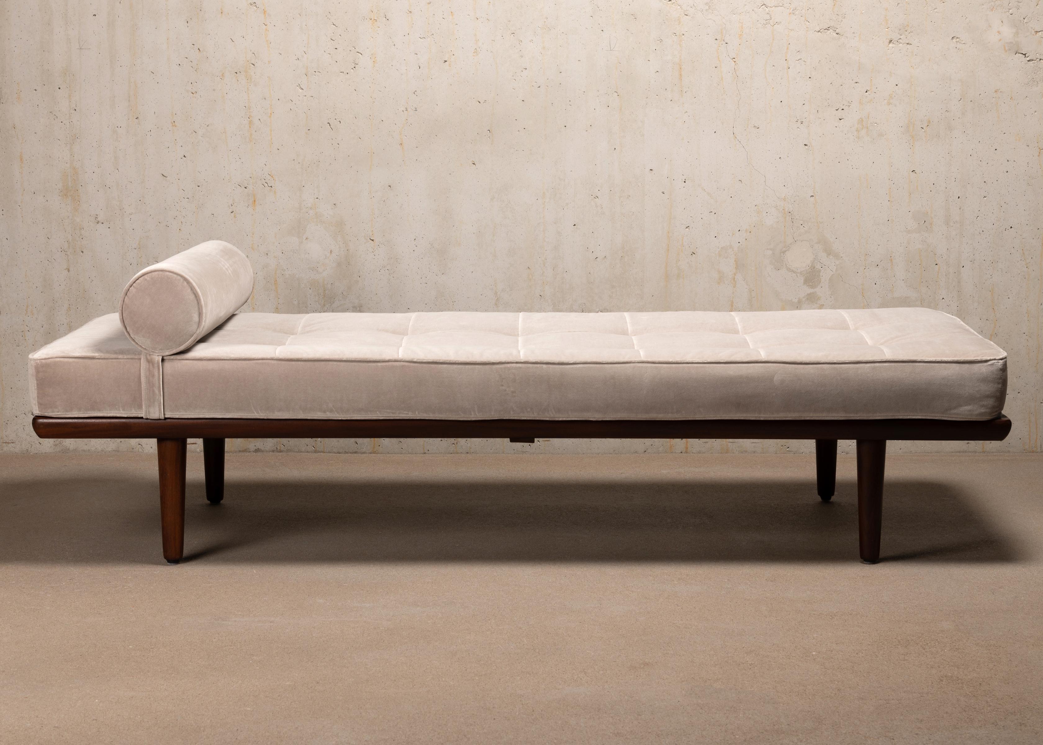 Great daybed Model GE19, designed by Hans Hans J. Wegner for GETAMA Denmark in 1956. Teak frame with tapered legs in good condition with minor traces of use. New mattress and neck roll pillow upholstered in beautiful high quality soft Kvadrat Harald