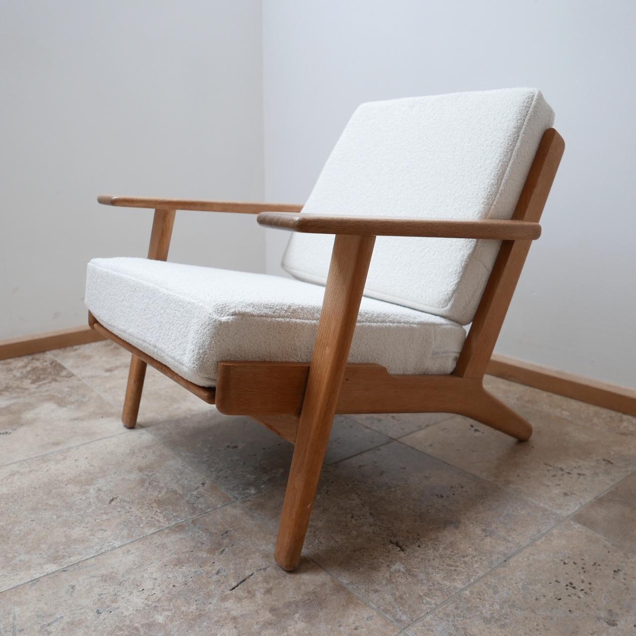 Easy armchair by Hans J Wegner for GETAMA,

circa 1960s

GE290 Model.

An original model not a contemporary copy. Stamped to base. 

Fully re-upholstered with new foam, white bouclé fabric from Chase Erwin. 

Dimensions: 76 W x 80 D x 40