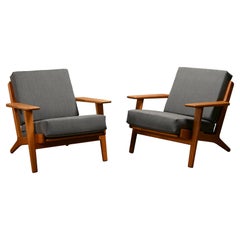 Hans J. Wegner GE290 Pair Easy Chairs in blue grey wool and Oak for GETAMA