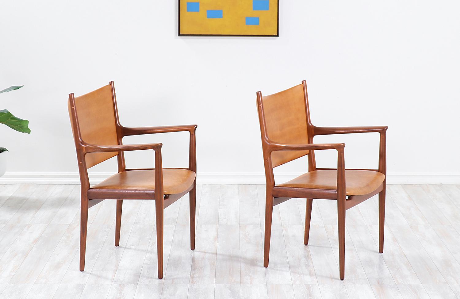 Pair of models JH-509 armchairs designed by iconic Danish architect Hans J. Wegner in collaboration with the famous workshop of Johannes Hansen in Denmark during the 1950s. Initially designed for conference and meeting rooms, these ergonomic chairs