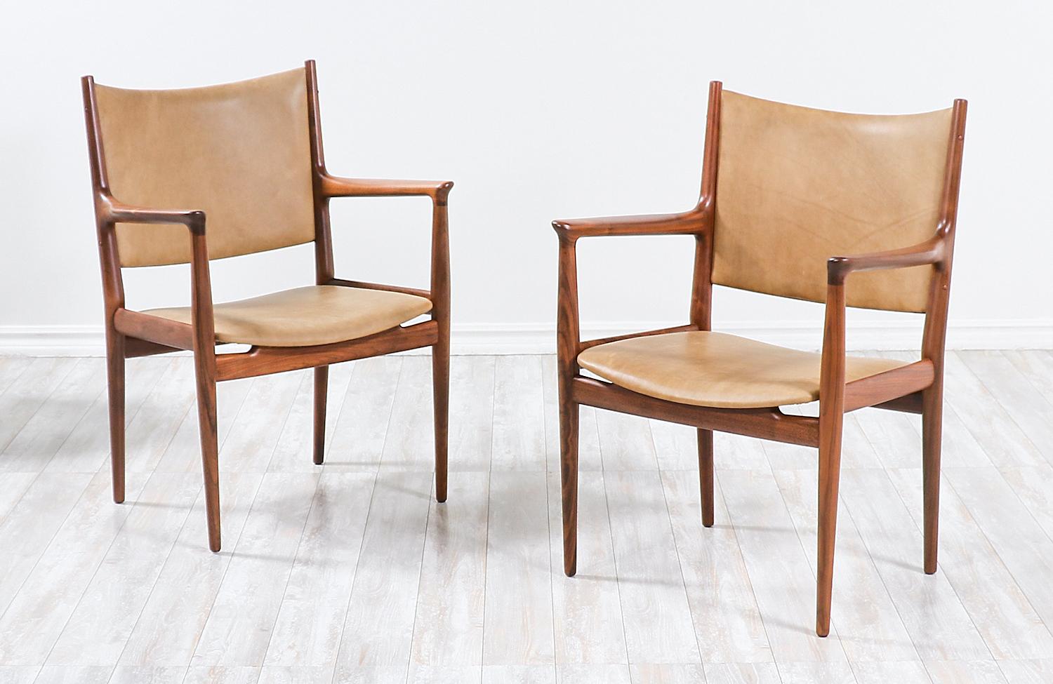 Pair of models JH-509 armchairs designed by iconic Danish architect Hans J. Wegner in collaboration with the famous workshop of Johannes Hansen in Denmark during the 1950s. Initially designed for conference and meeting rooms, these ergonomic chairs