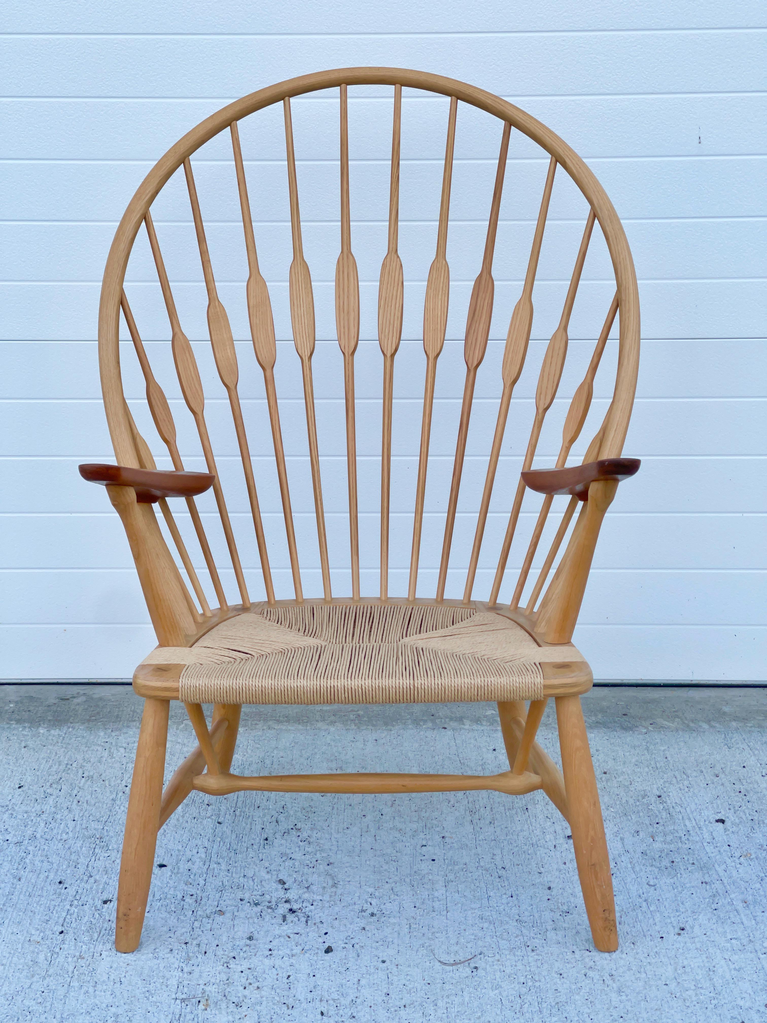 Hans J. Wegner model JH-550 Peacock chair for Johannes Hansen, designed in 1947, produced circa 1960, Denmark. Stamped by maker.
Outstanding original condition with no splits or repairs.
Corded seat newly replaced.
Model presented at The Copenhagen