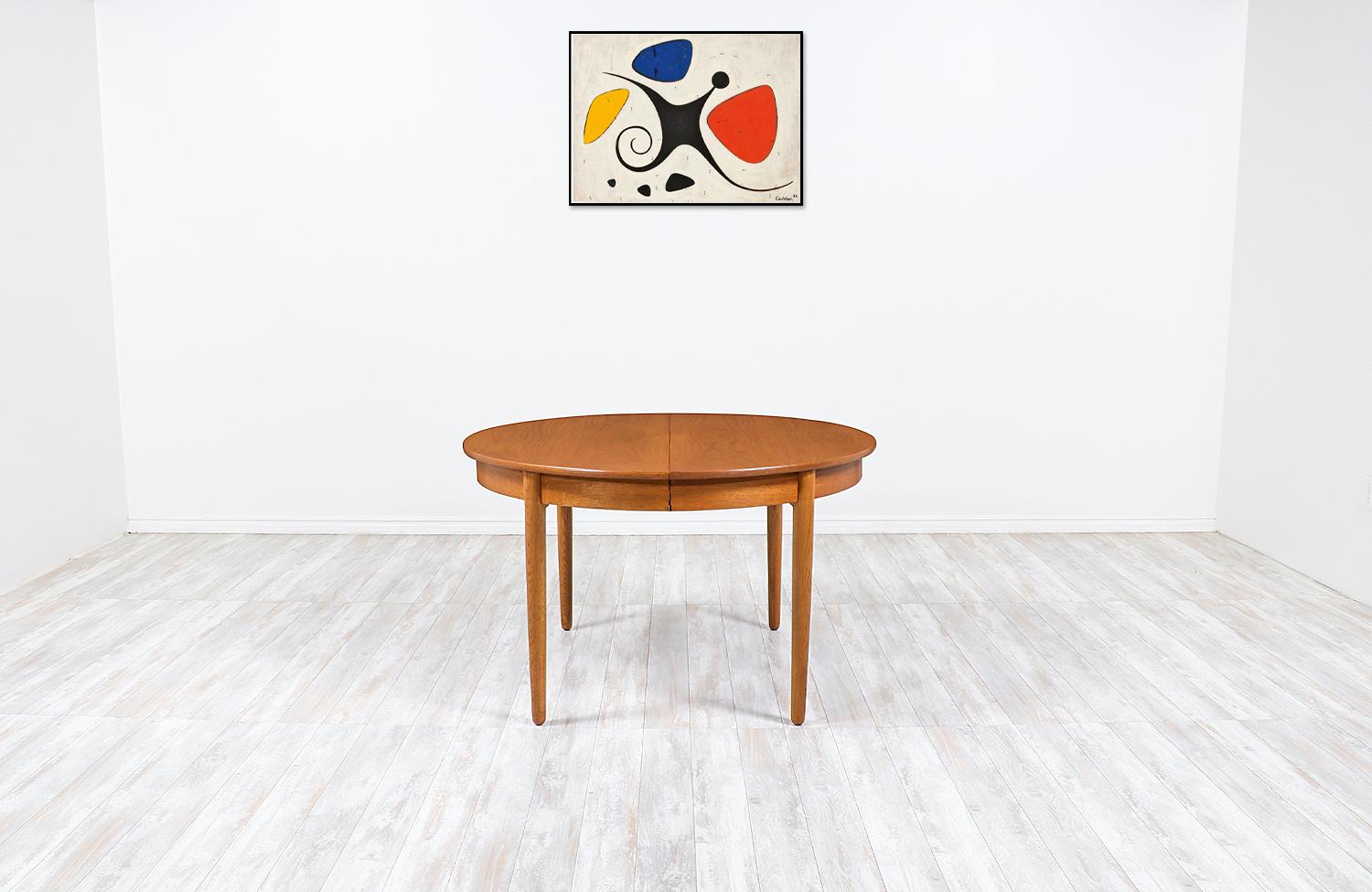 Hans J. Wegner large expanding round dining table for Andreas Tuck

Dimensions:
28.50 in H x 47 in W, 117.5 in W x 47 in D
Each extension leaf 23.50 in.
 
     