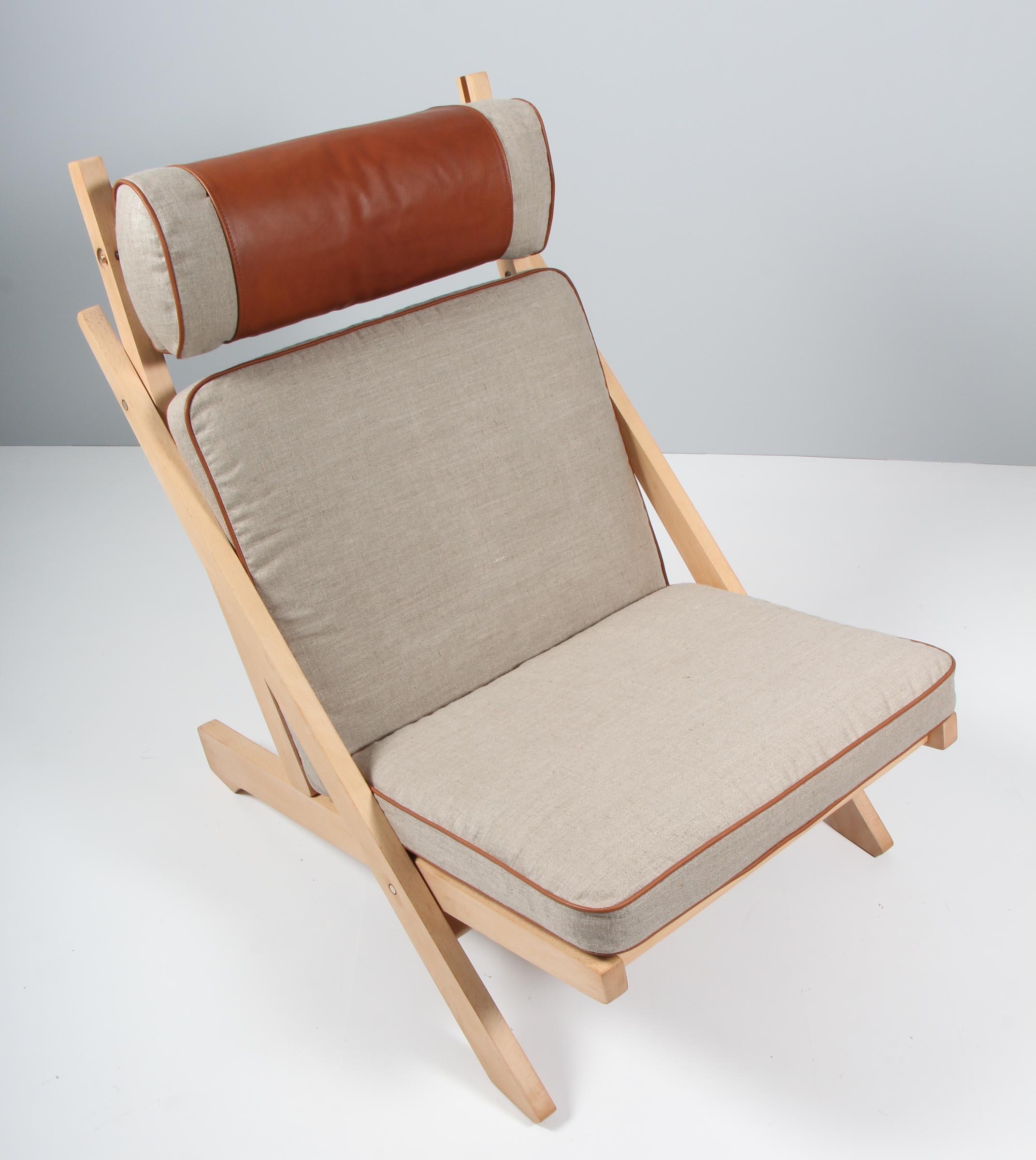 Hans J. Wegner Lounge chair with frame of solid soap treated beech. With boat cord in the seat. 

New upholstered with canvas with aniline leather details.

Model CH3, made by Carl Hansen. Rarely seen model.