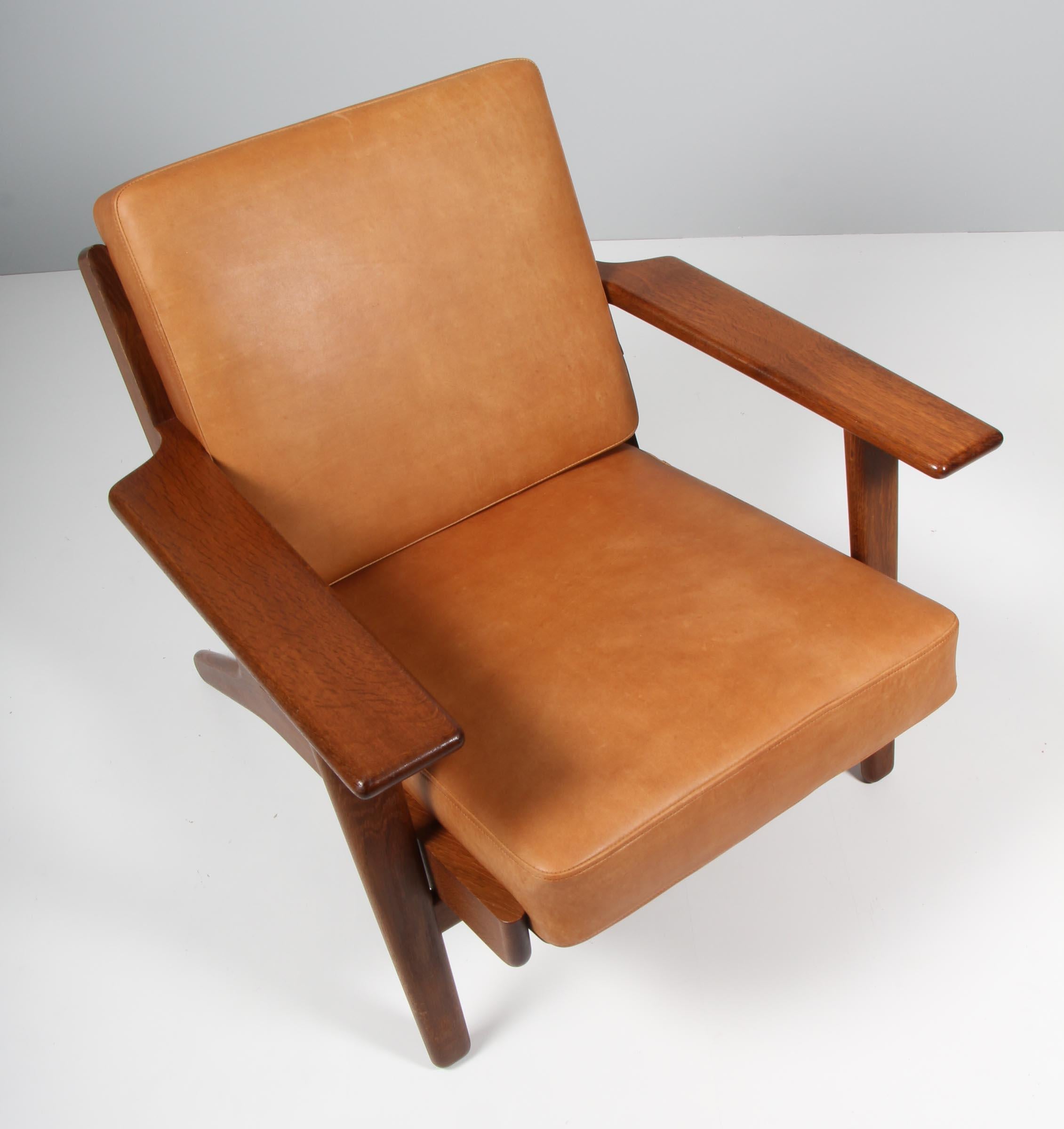 Hans J. Wegner lounge chair made of solid smoked oak.

New upholstered with vintage tan aniline leather.

Model 290, made by GETAMA.

 