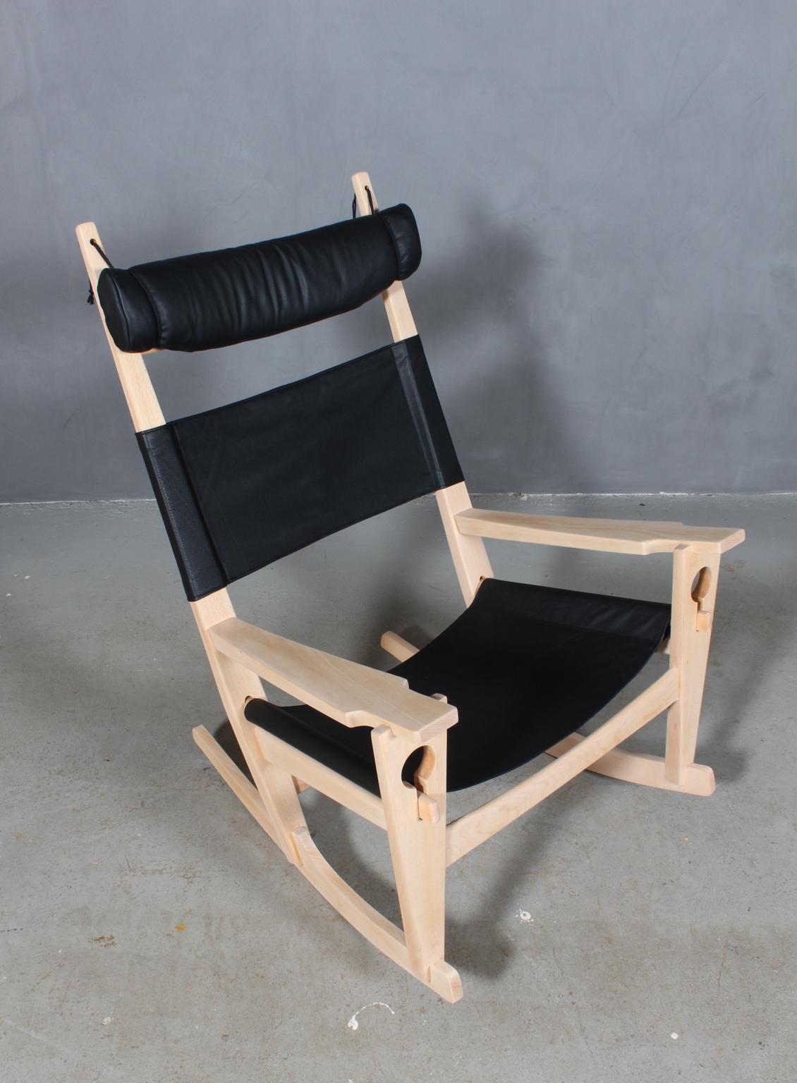 Hans J. Wegner lounge chair / rocking chair new upholstered with black aniline leather.

Frame of soap treated beech.

Model Nøglehullet, made by GETAMA.