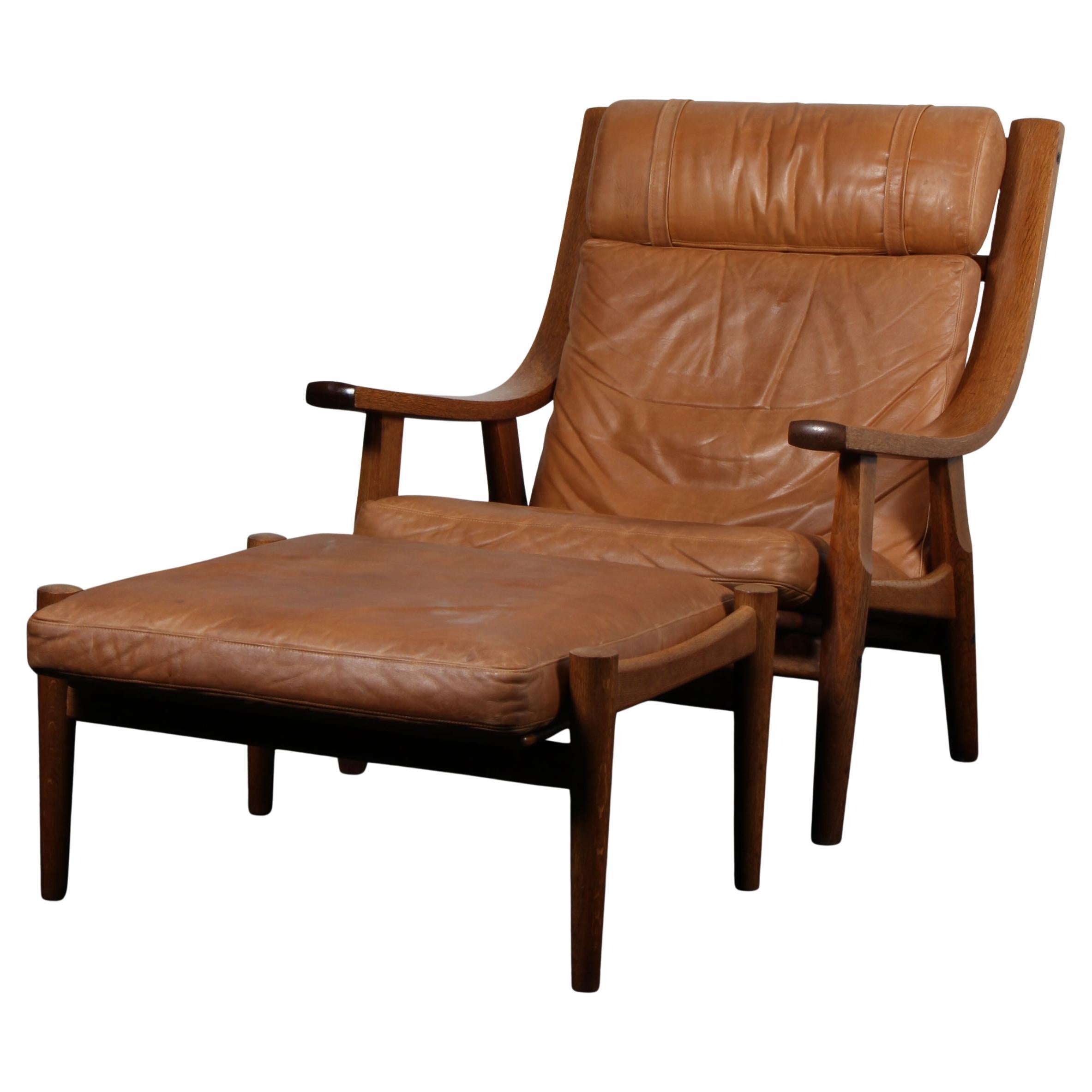 Hans J. Wegner, Lounge chair with ottoman, Model GE530, smoked oak, leather en venta