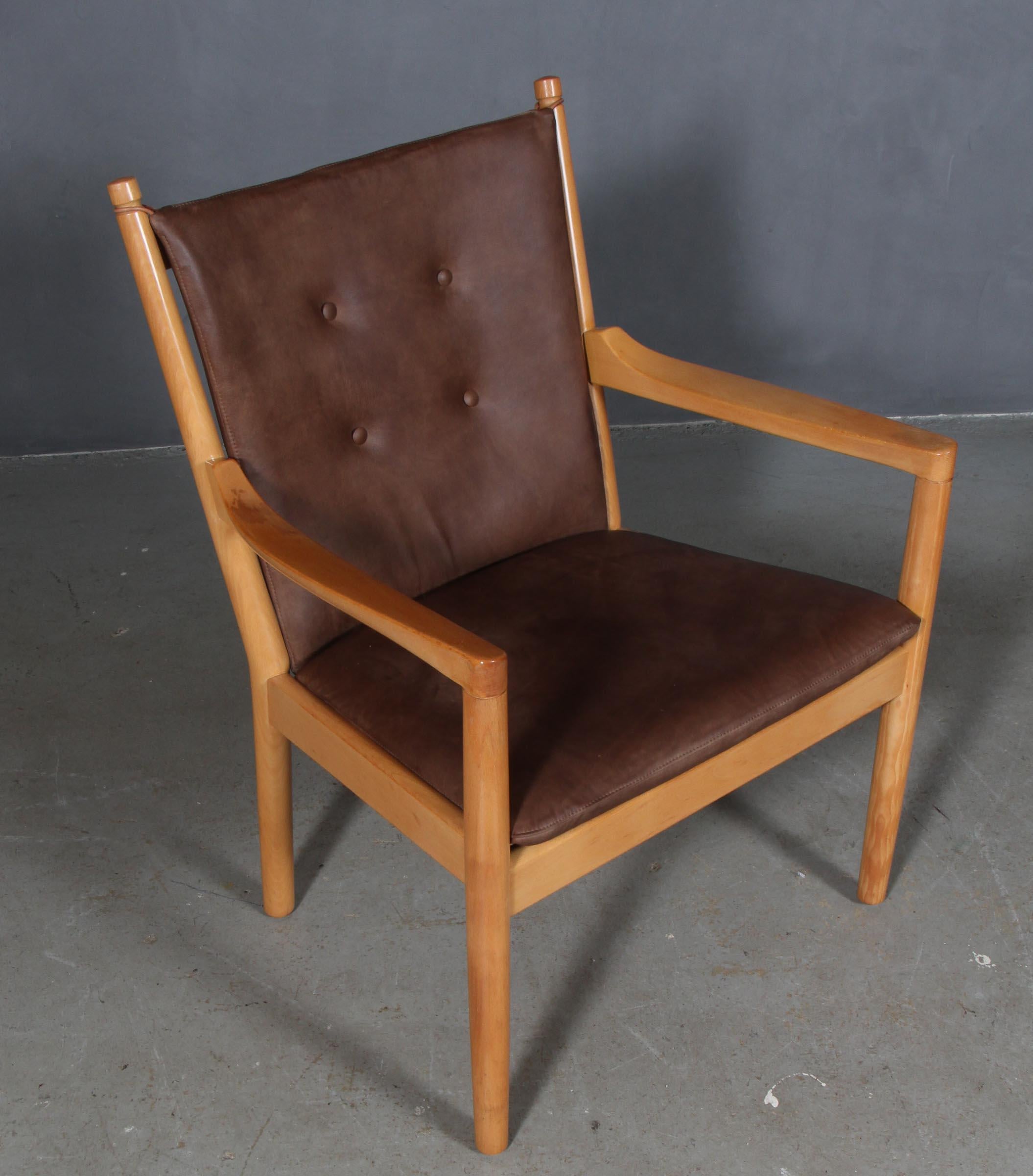 Hans Wegner, lounge or armchair new upholstered with brown leather.

Frame in solid beech.

Model 1788, made by Fritz Hansen.

