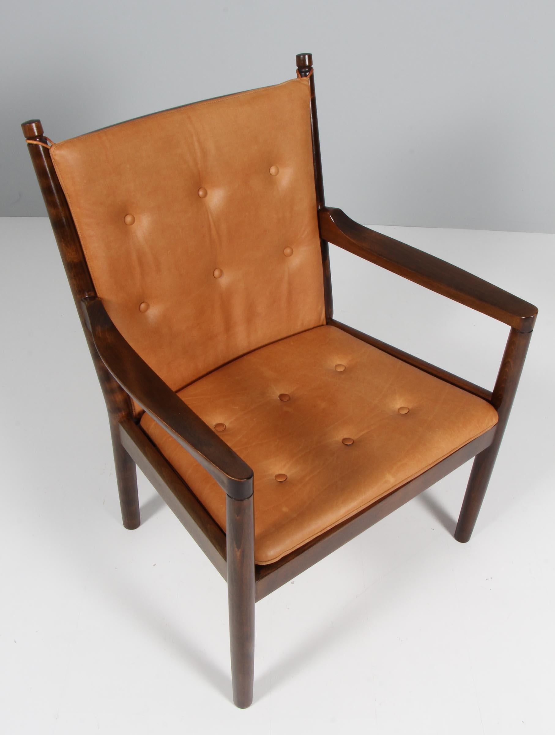 Hans Wegner, lounge or armchair new upholstered with tan aniline leather.

Frame in solid stained beech.

Model 1788, made by Fritz Hansen.

