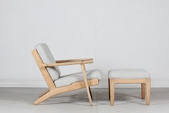 Hans J. Wegner Low Lounge Chair GE 290 + Stool of Oak and Wool by GETAMA, 1970s