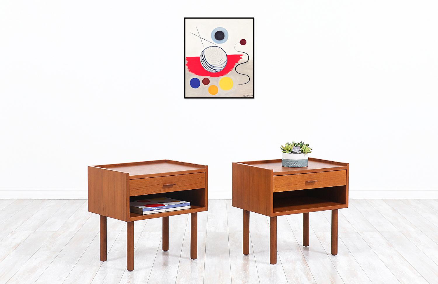 Pair of Danish Modern nightstands designed by our favorite architect and designer Hans J. Wegner who worked in collaboration with Ry Møbler to Craft these beauties in Denmark circa 1950s. Our beautiful set of nightstands feature sturdy teak wood