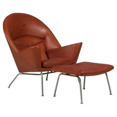 Chaise longue et pouf Oculus de Hans J. Wegner en cuir de marque Full grain