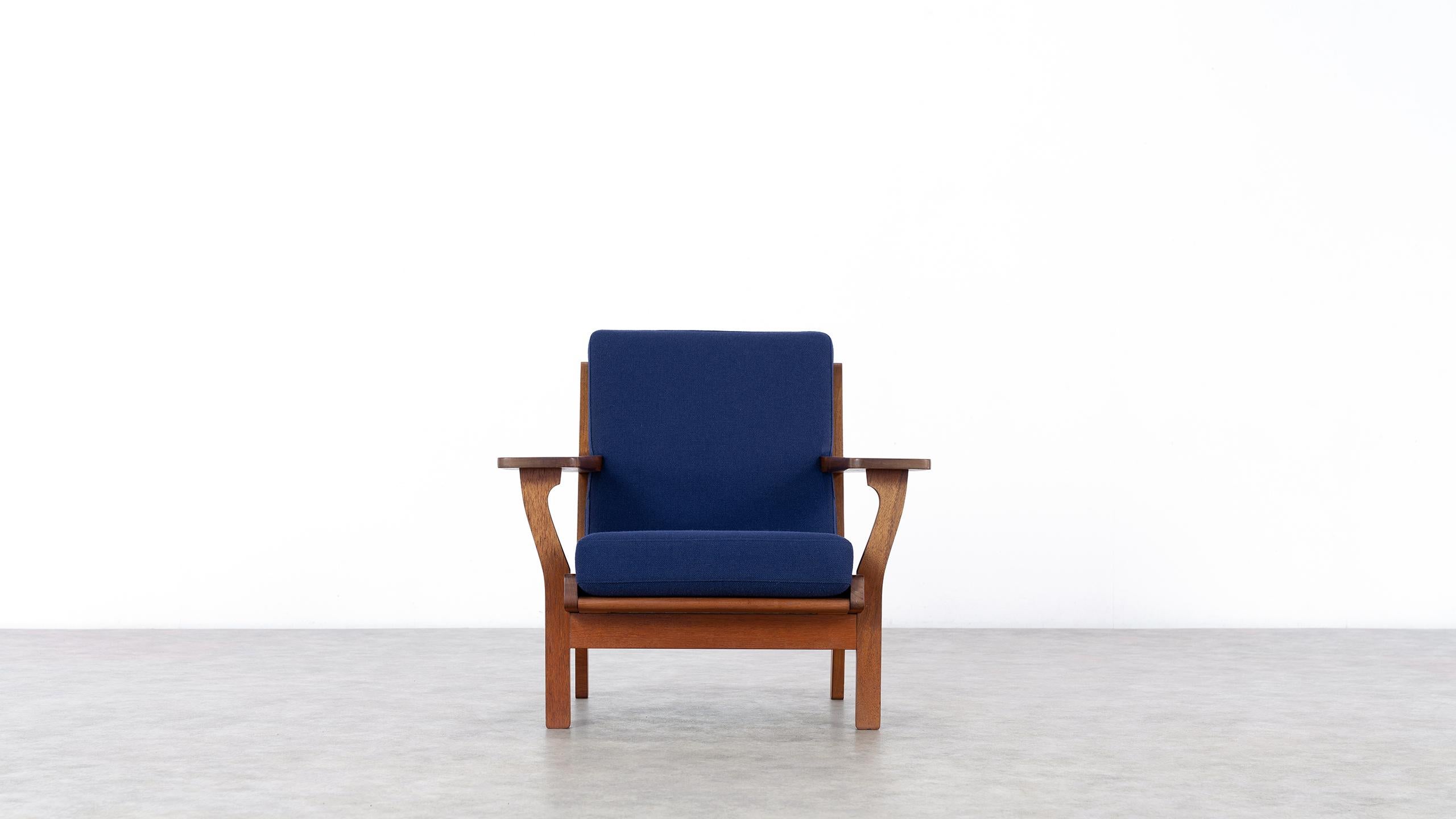 Here you have the opportunity to purchase an extremely rare lounge chair by Hans J. Wegner, designed in 1956 for GETAMA in Denmark. 
The stamped and handcrafted frame is made of teak.

GETAMA still produces many of Wegner's designs today, but not