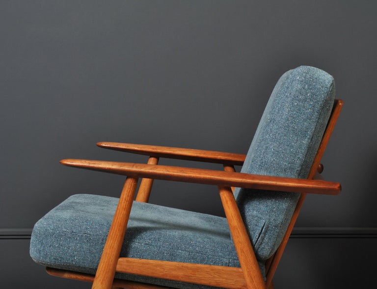 Original 1950’s GE240 ‘cigar’ chair by Hans J Wegner. 
A true classic Hans J Wegner design for Getama, Denmark. Constructed from oak with teak arms. Upholstered in Kvadrat fabric on original metal sprung cushions. 
Original Hans J Wegner and