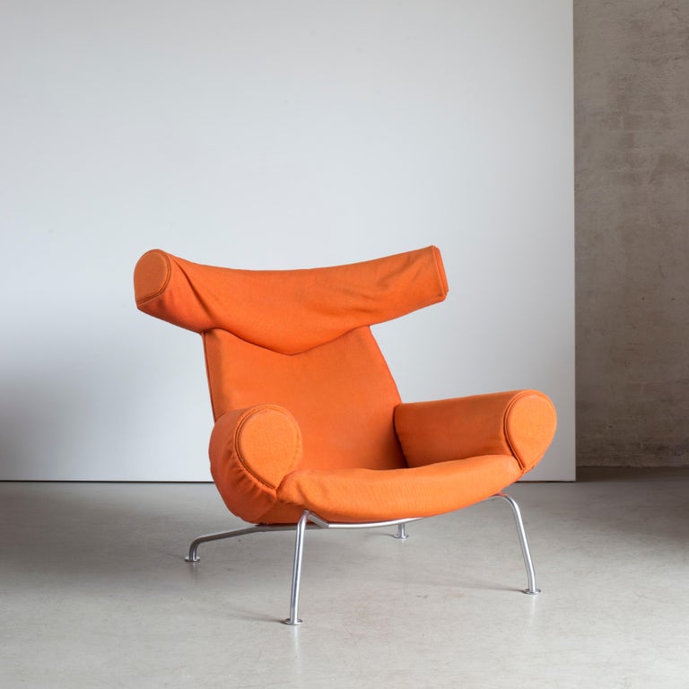 Hans J. Wegner 'Ox-chair' model AP-46. Easy chair with tubular steel frame. Sides, seat and back upholstered with orange fabric.

Executed by AP-Stolen, Copenhagen, Denmark.