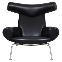 Vintage Hans J. Wegner Ox Chair Patinated Lounge Chair in Black Aniline Leather
