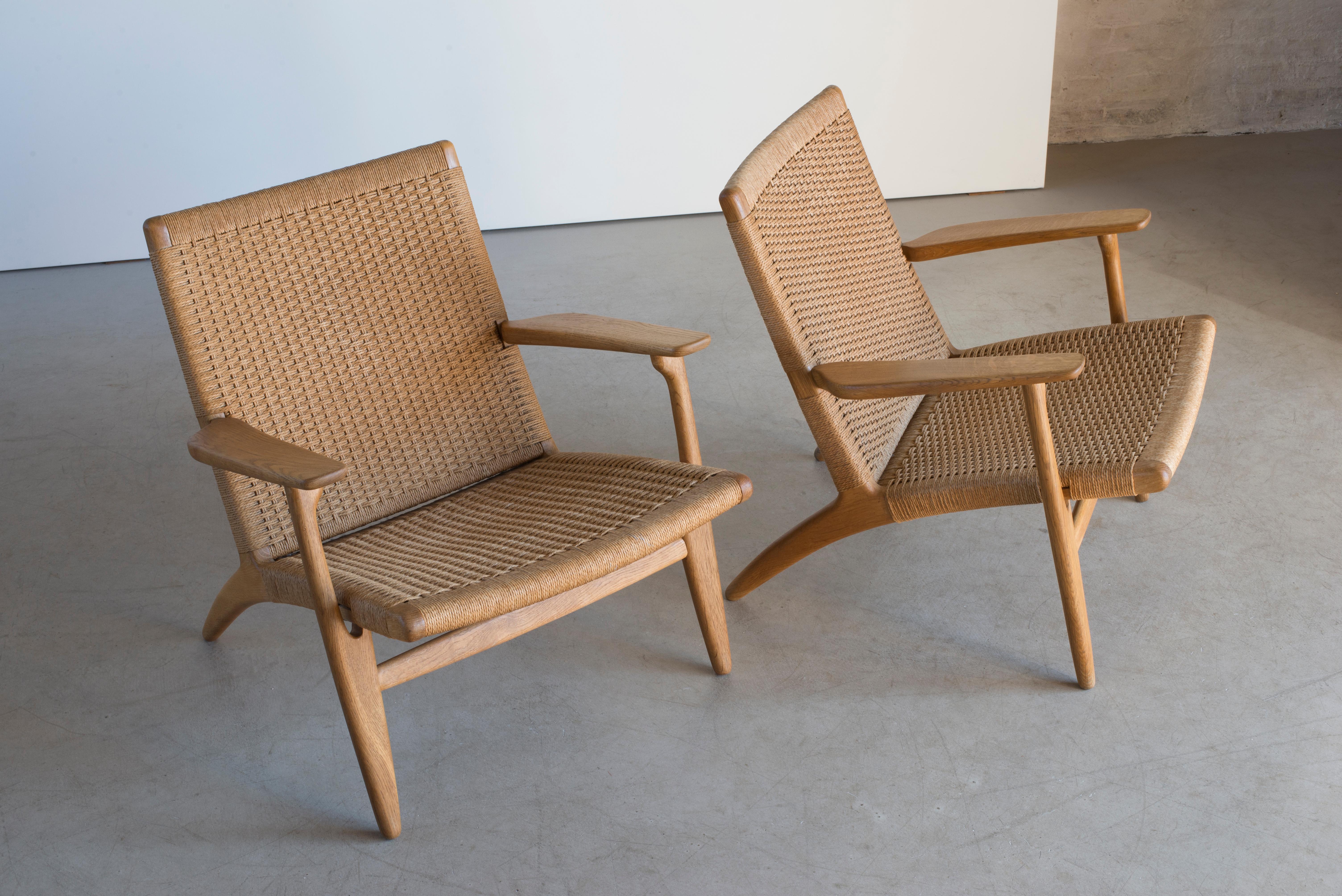 Polished Hans J. Wegner Pair of Easy Chairs “CH 25” for Carl Hansen