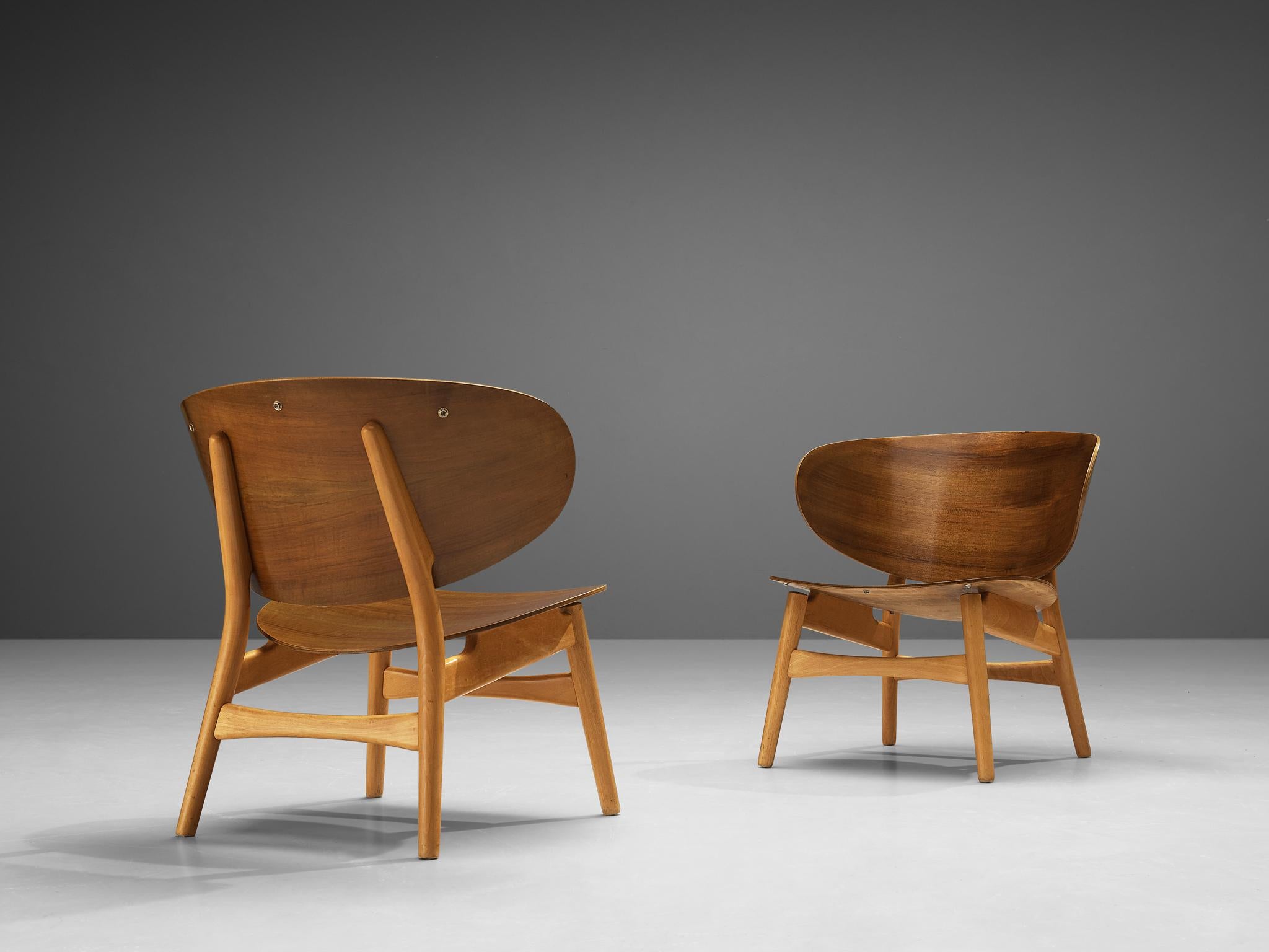 Hans J. Wegner for Fritz Hansen, pair of FH 1936 lounge chairs, walnut, beech, Denmark, design 1948, manufactured, circa 1950

The FH 1936 lounge chair is one of the results of Wegner's efforts in designing furniture with plywood shells. Wegner