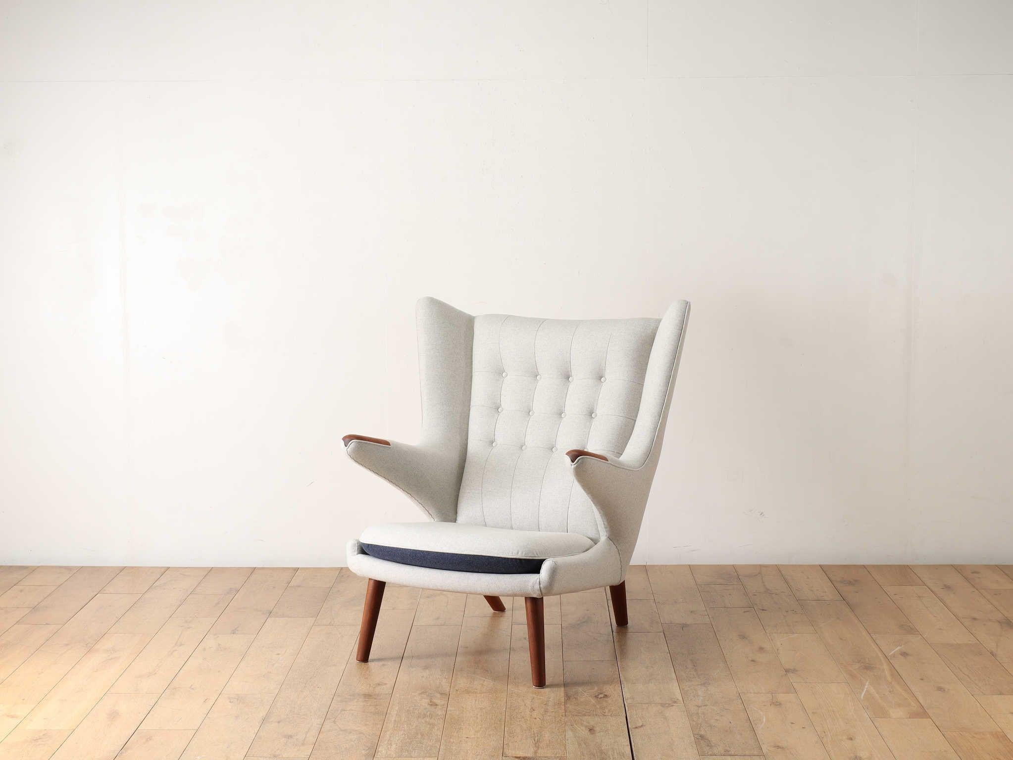 The Papa Bear Chair, designed by Hans J. Wegner, is one of the most iconic pieces of Danish vintage furniture. It is described as having the appearance of a bear with its hands outstretched, and is currently made by PP Mobler. This is a vintage
