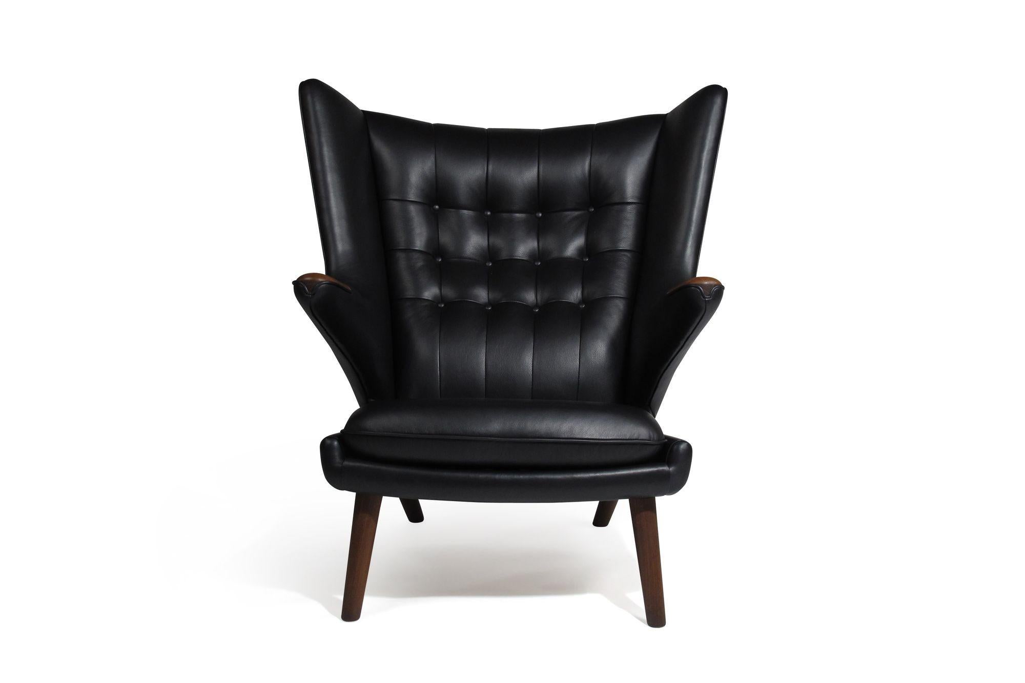 Hans J. Wegner for Anker Pedersen model AP19 Papa bear lounge chair and ottoman, 1953, Denmark.
Perfectly restored to the original specifications in Swedish Elmo black leather over horsehair and cotton padding.

Measurements: 36’’W X 38’’D X 39’’H,
