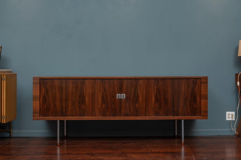 Hans J. Wegner rosewood credenza model RY25 for Rye Mobler Denmark. 
The rarest and most sophisticated credenza designed by the master of Danish modern design in Brazilian rosewood and white oak on brushed stainless steel legs. Adjustable drawers