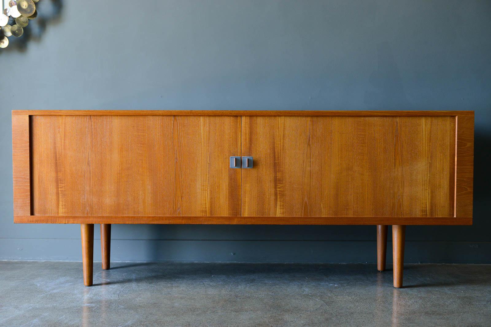 Hans J. Wegner 'President' Tambour door credenza, ca. 1960. Beautiful original condition with only slight wear. Tambour doors glide smoothly with no gaps in the doors. Beautiful adjustable height inside drawers and adjustable side shelving. Credenza