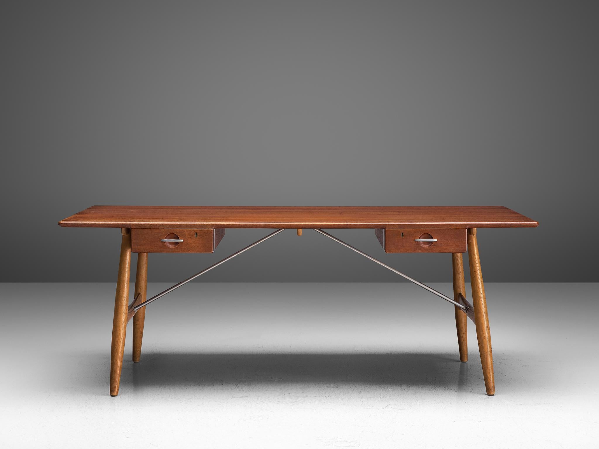 Hans J. Wegner for Johannes Hansen, desk JH571, teak, oak, metal, Denmark, design 1953

Out of all the desks that Wegner designed, the ‘JH571‘ is the most 'Wegnerian'. This is mostly due to the boldly angled legs that are being held in place by