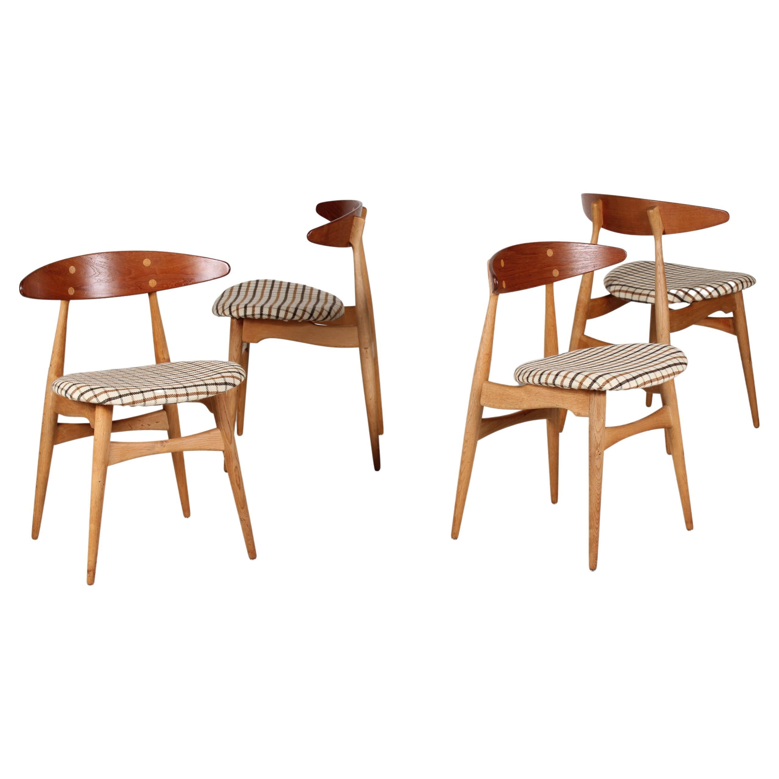 Ensemble de quatre chaises en chêne et teck modèle CH33 de Hans J. Wegner, Carl Hansen & Son en vente
