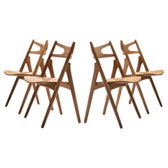 Hans J. Wegner - Ensemble de quatre chaises de salle à manger "Sawbuck" en chêne 
