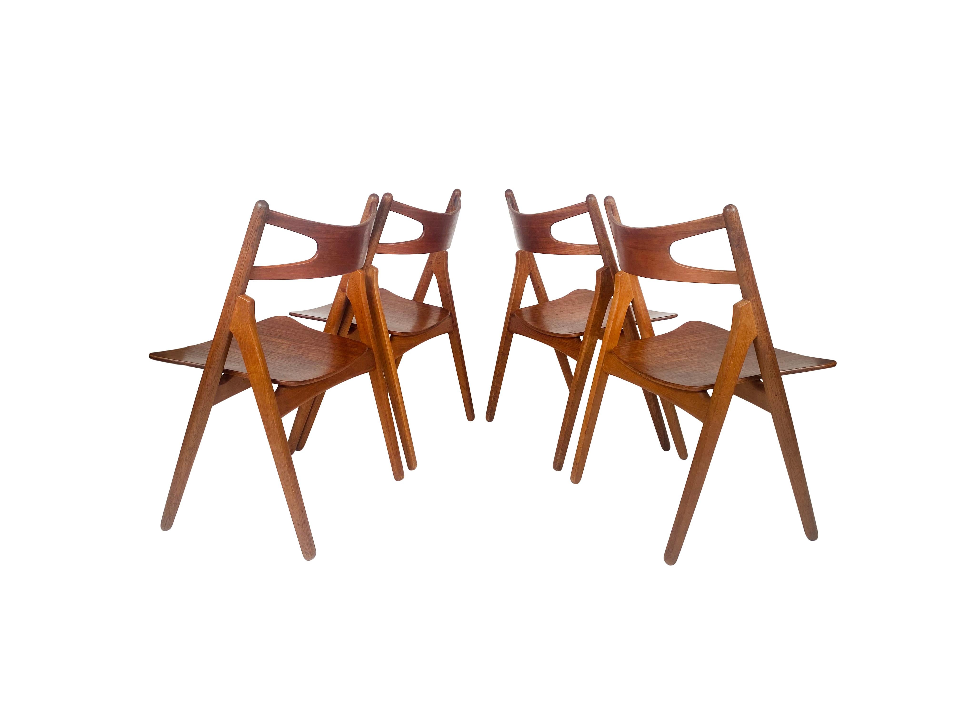Scandinavian Modern Hans J. Wegner, set of four 'Sawbuck' CH29 chairs, teak and oak, Denmark 1950s