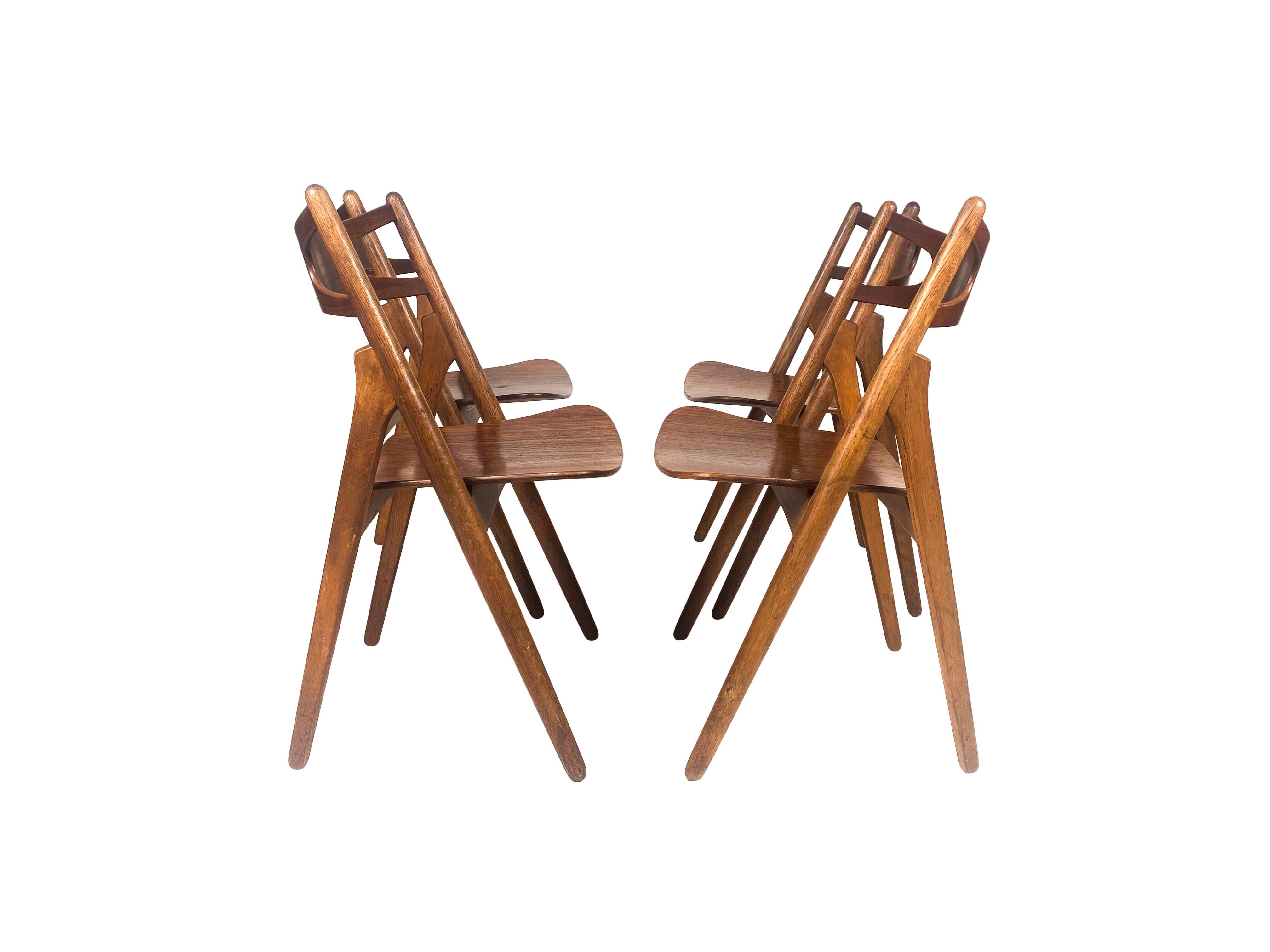Danish Hans J. Wegner, set of four 'Sawbuck' CH29 chairs, teak and oak, Denmark 1950s