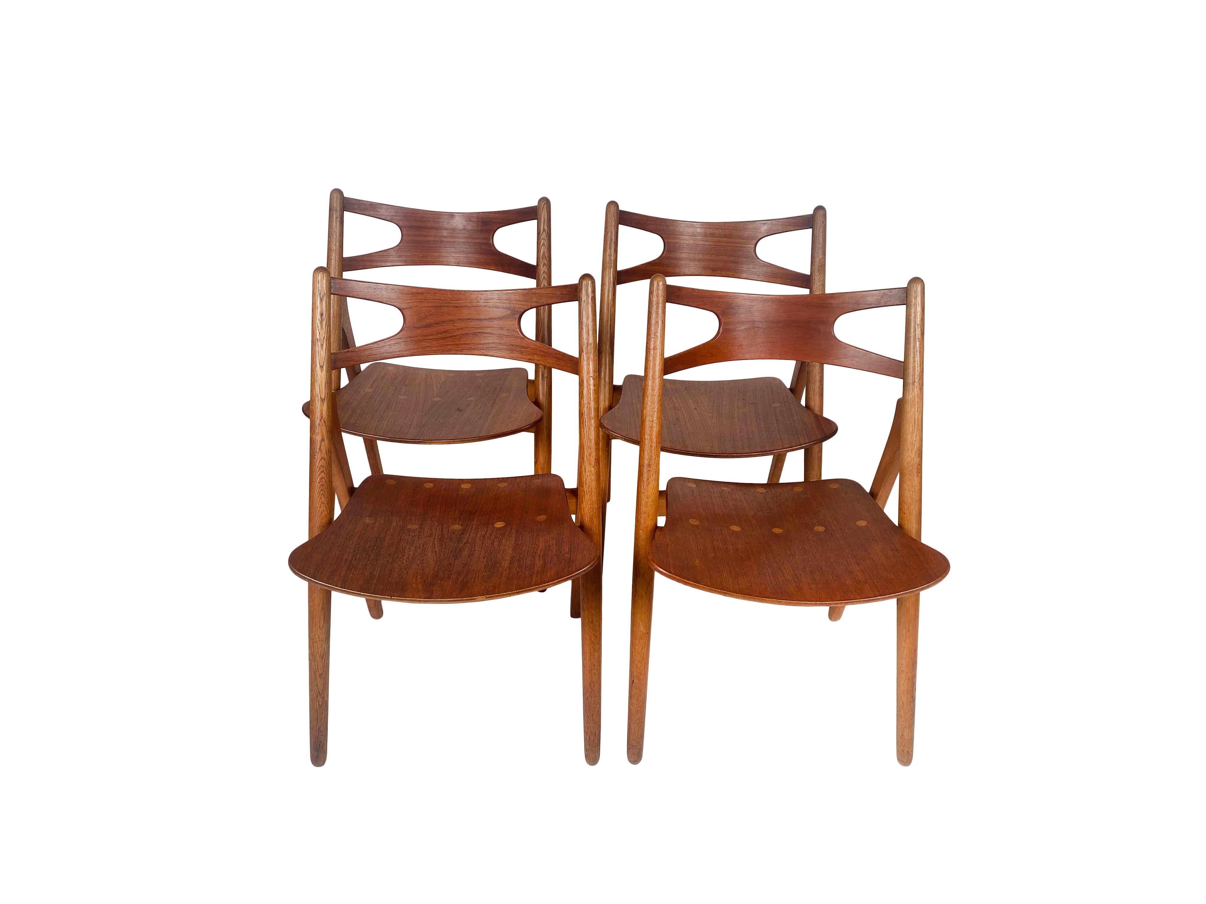 Mid-20th Century Hans J. Wegner, set of four 'Sawbuck' CH29 chairs, teak and oak, Denmark 1950s