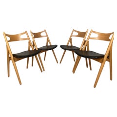 Hans J. Wegner, set of four 'Sawbuck' CH29 dining chairs in wood/leather Denmark Hans J. Wegner, set of four 'Sawbuck' CH29 dining chairs in wood/leather Denmark