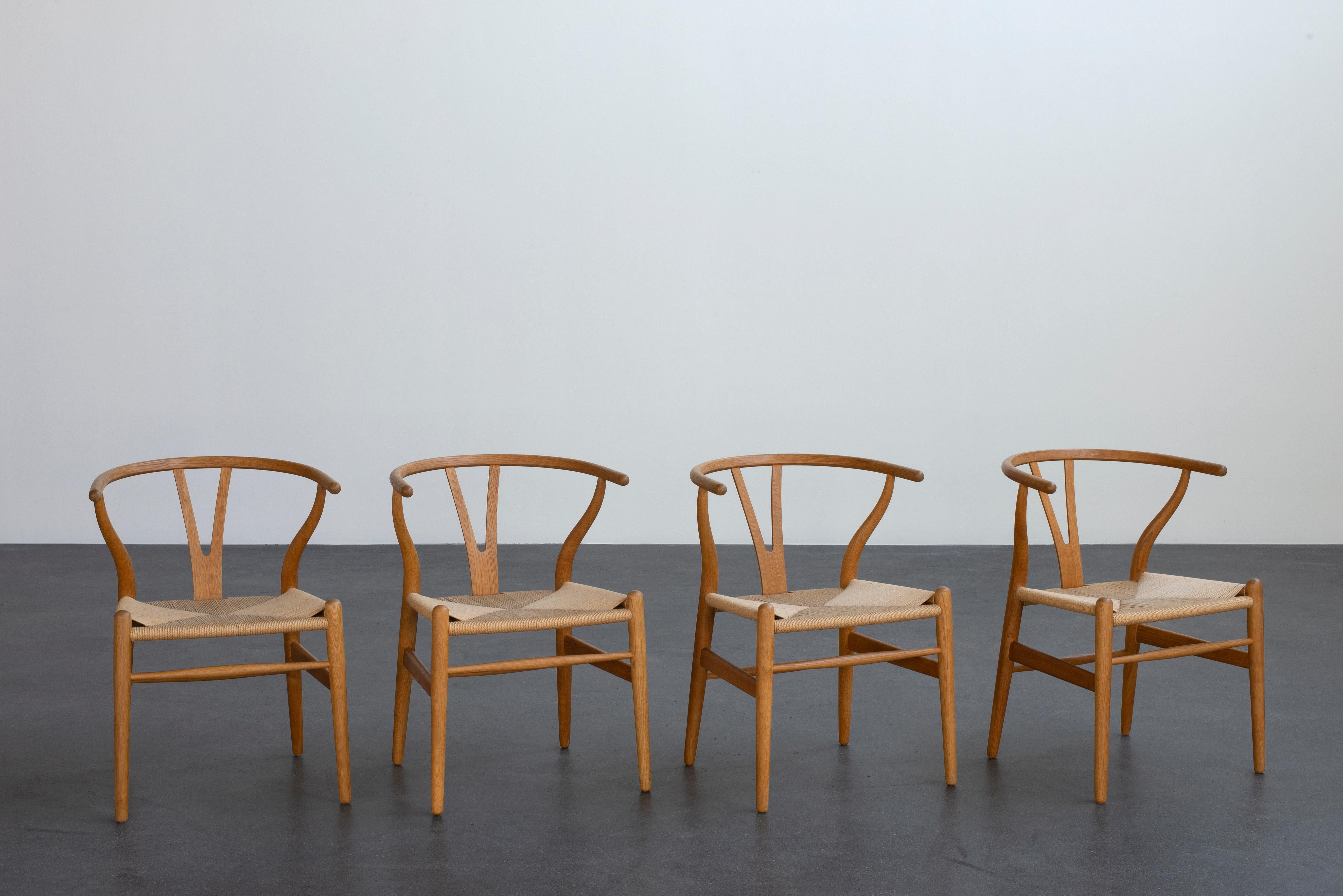 Scandinavian Modern Hans J. Wegner Set of Four “Wishbone” Chairs in Oak