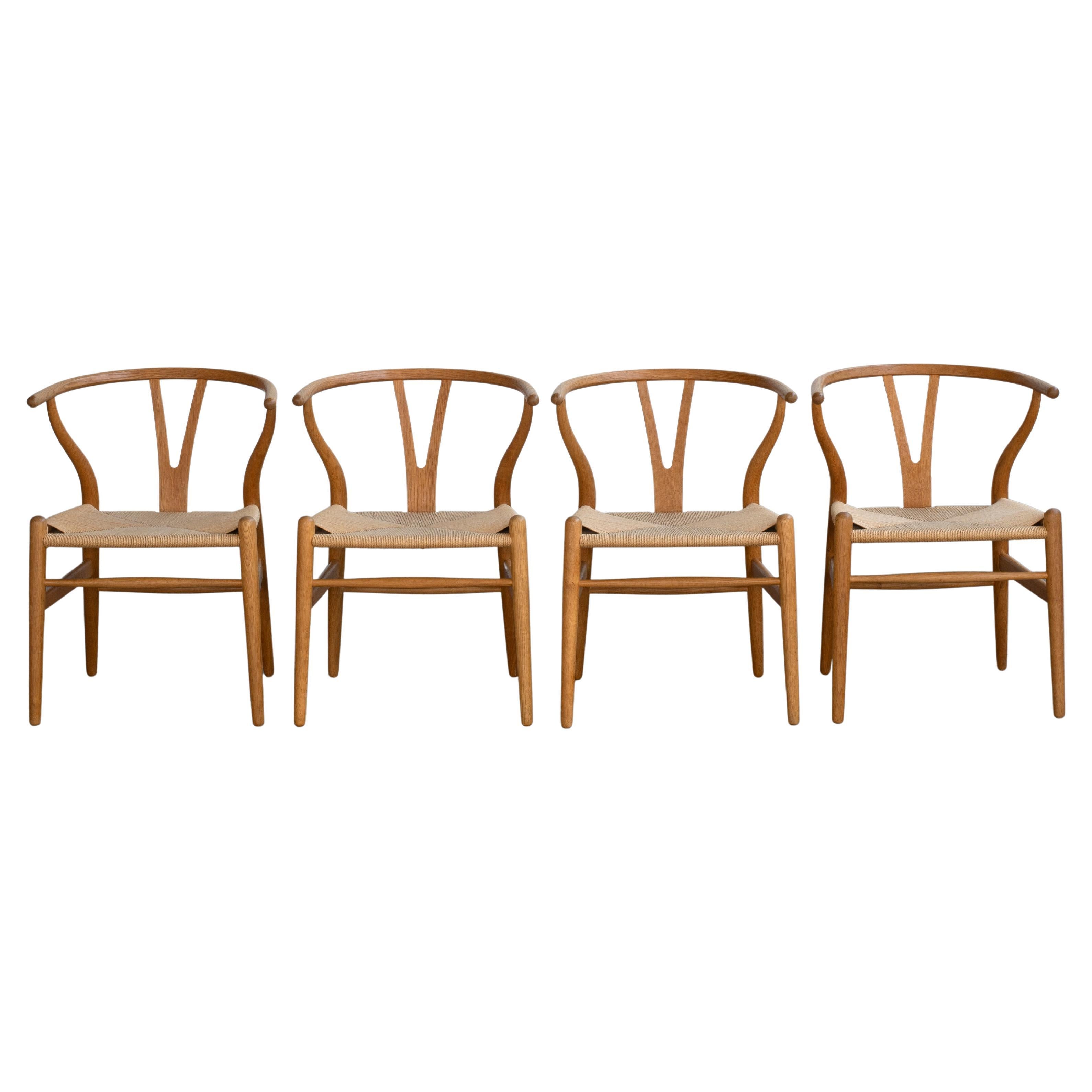 Hans J. Wegner Set of Four “Wishbone” Chairs in Oak