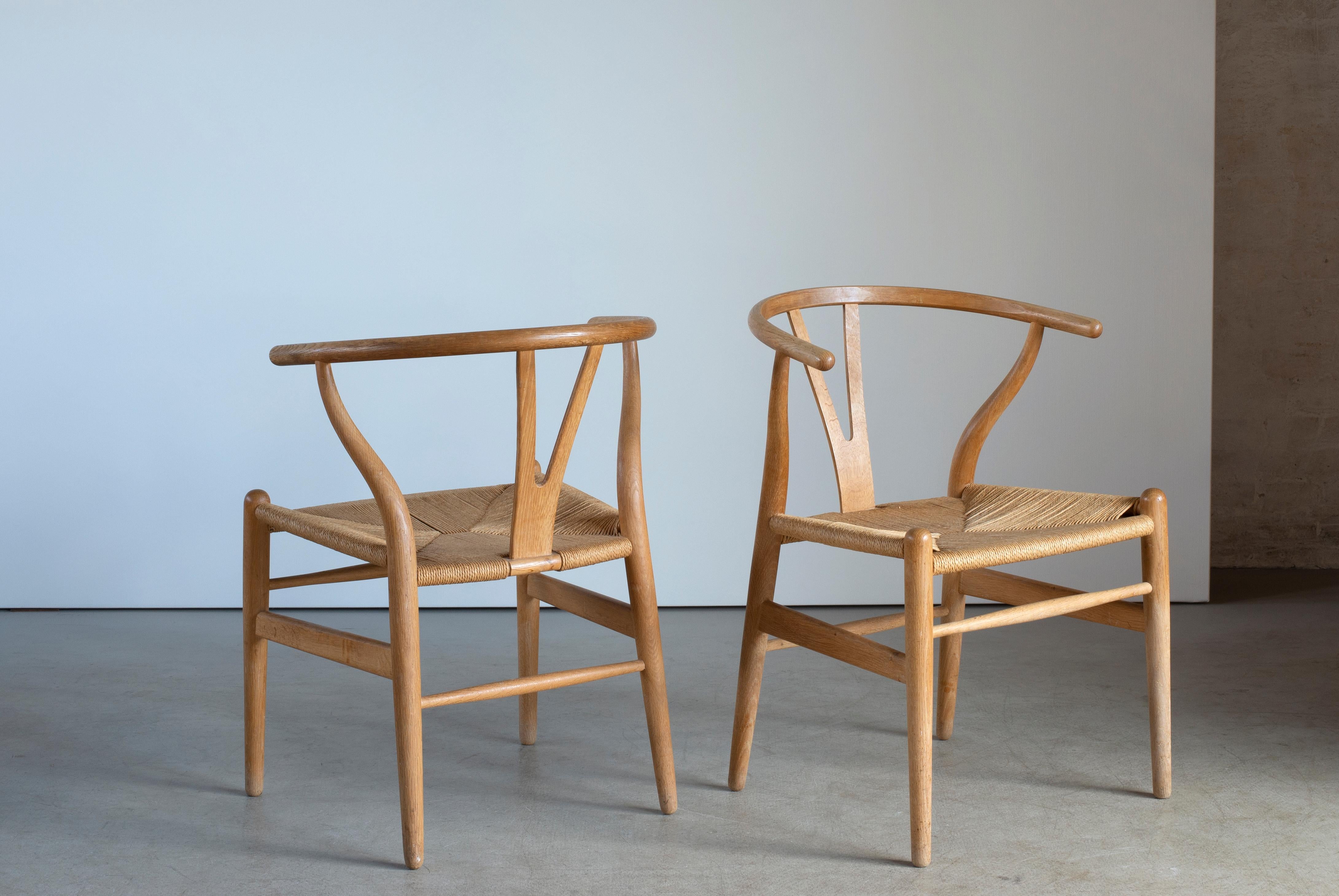 Polished Hans J. Wegner Set of Six “Wishbone” Chairs in Oak For Sale