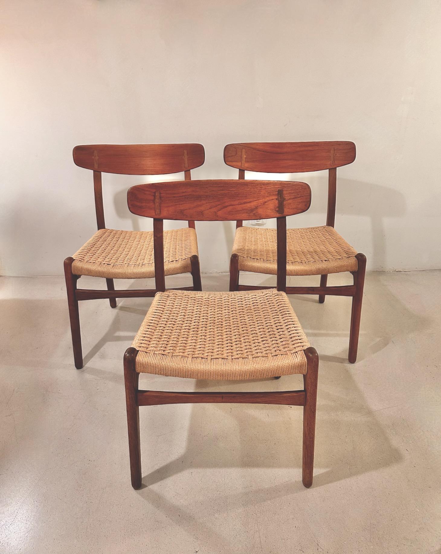 A vintage set of eight CH23 designed by Hans J. Wegner and edited by Carl Hansen in 1960.Oak framework , teak backs and original paper-cord.Organic , modern and functional design combined with natural materials bringing about extraordinary