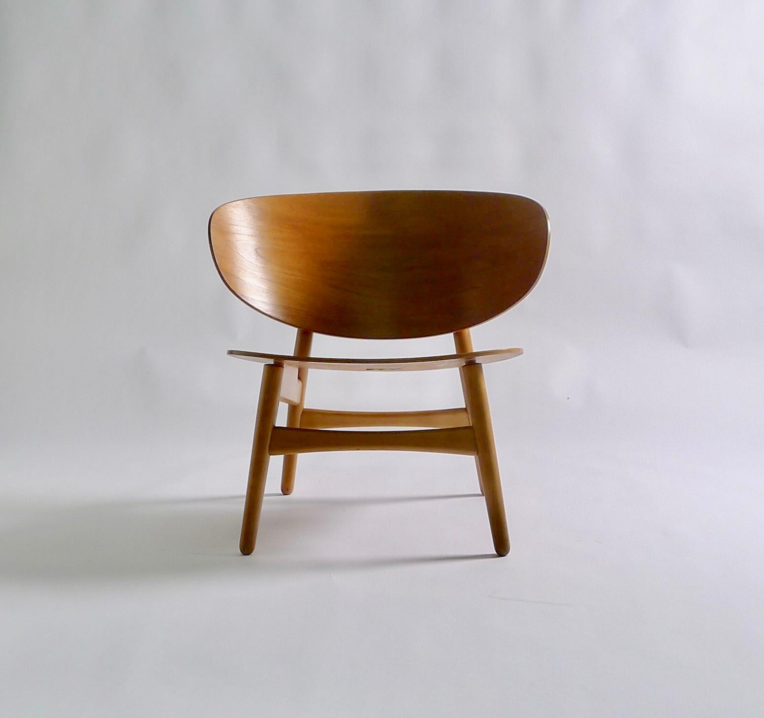 Hans J Wegner shell chair, model FH1936, made by Fritz Hansen, design 1948.

This iconic chair was manufactured by Fritz Hansen, Copenhagen, and bears the original paper label to the underside, as well as the stamped marks DENMARK / FH / 5235.