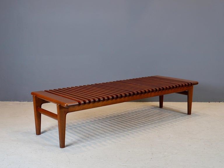 Slatted teak bench, or table designed by Hans J. Wegner and produced by Johannes Andersen, circa 1950s.
Bench slats have been cleaned and oiled with teak oil and over all bench is in excellent, sturdy condition.
  