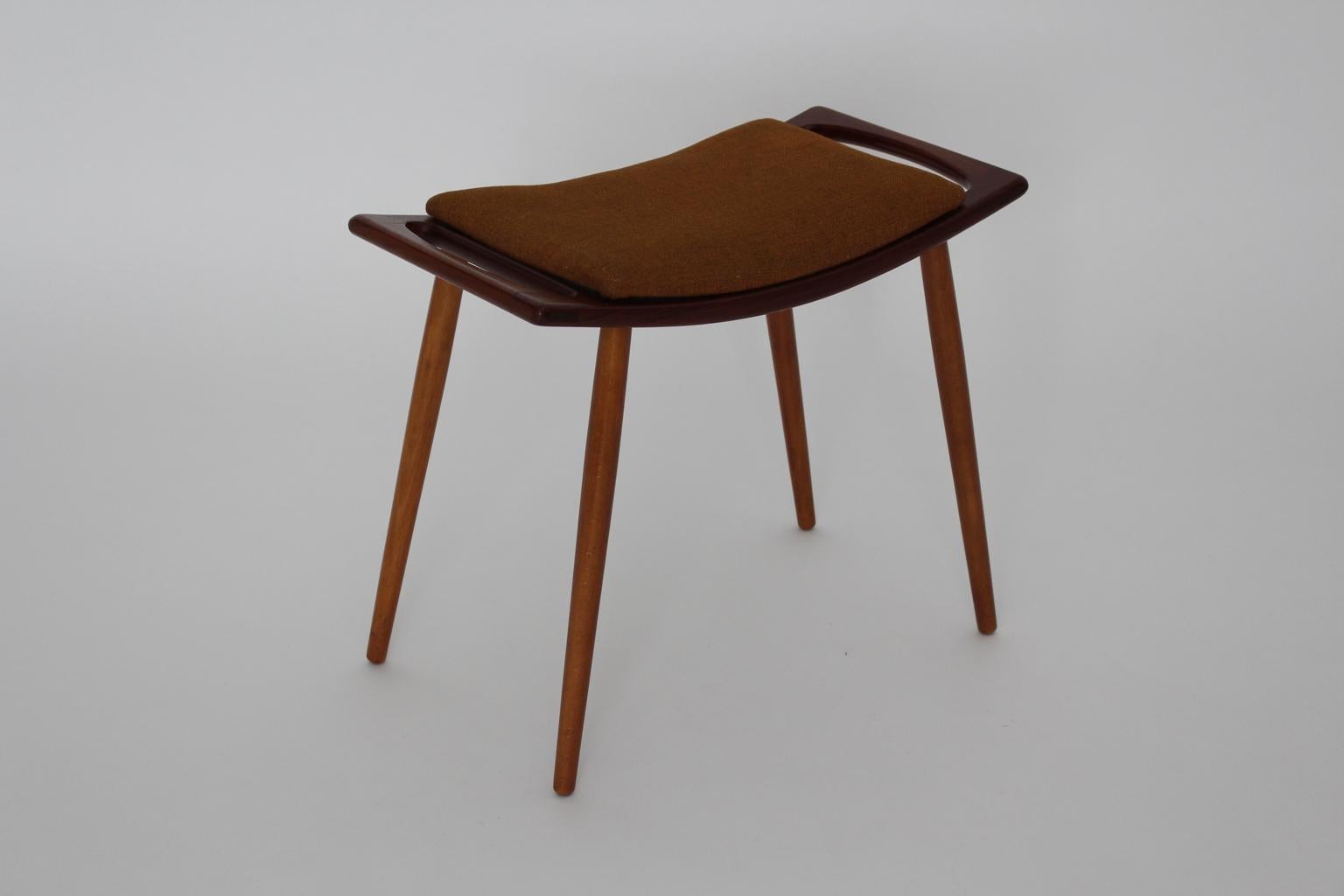 Mid Century Modern vintage stool from wood attributed to Hans J. Wegner 1950s Denmark.The stool shows underneath a paper label which gives the information model no. 85 and made in the 1950s.
Labelled underneath the seat
The seat is covered with the